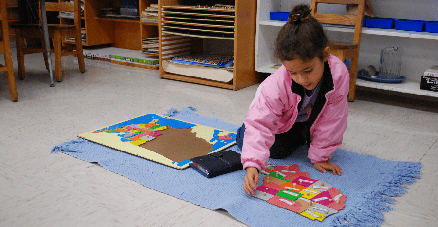 A Child Playing With a Puzzle